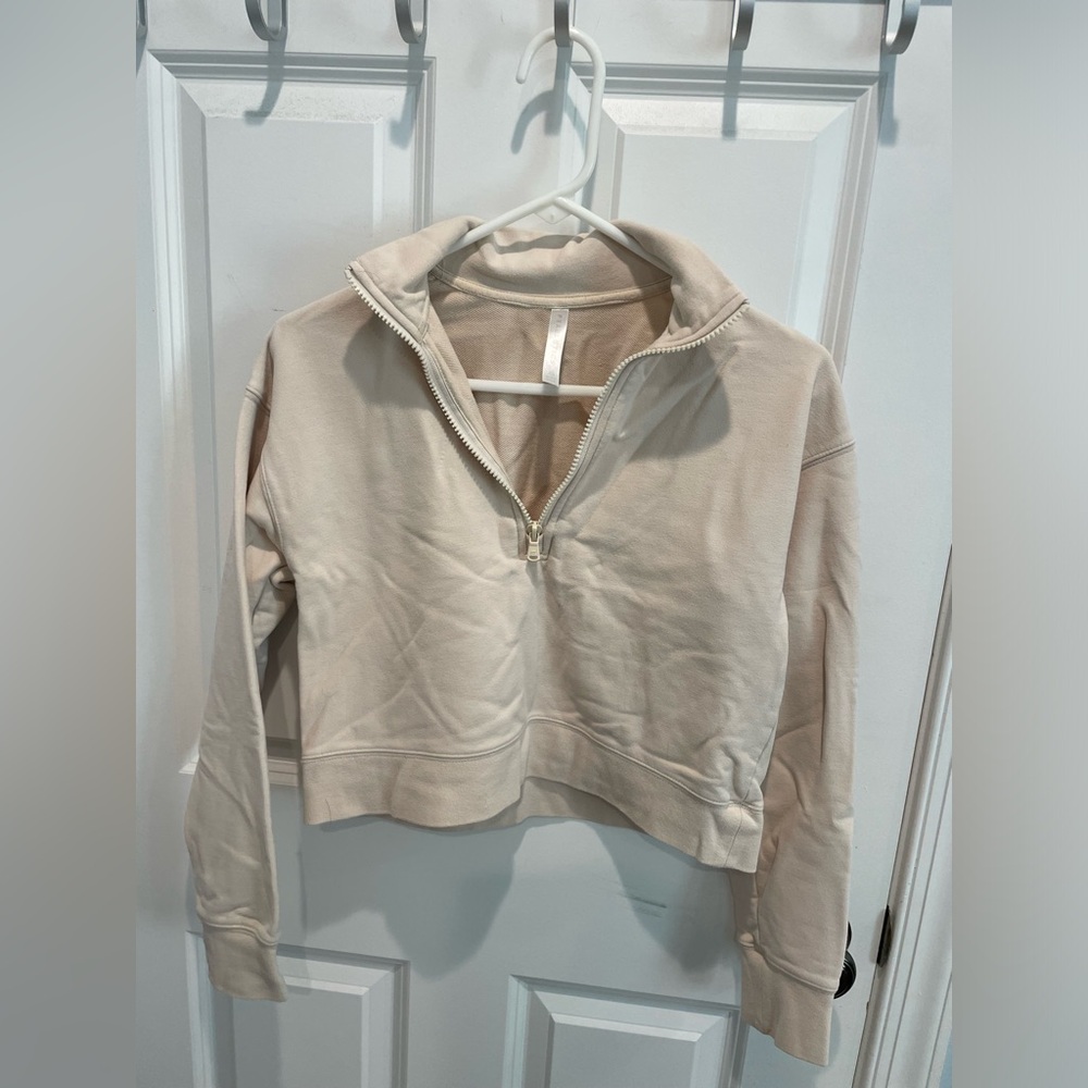 Beige fabletics cropped sweater.